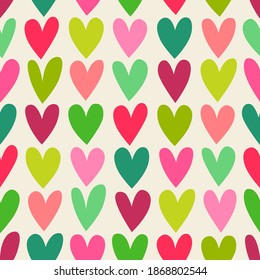 Red and green hand drawn heart pattern background for christmas holidays.