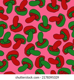 red and green mushrooms seamless pattern, mushrooms with a wide stalk on a pale pink background vector illustration