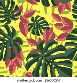 Red and green tropical foliage pattern on yellow background