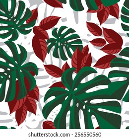 Red and green tropical foliage pattern on white background