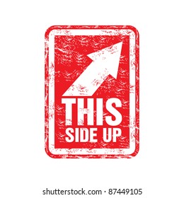 Red Grunge Rubber Stamp With An Arrow Showing The Right Up Corner And The Text This Side Up Written Inside The Stamp