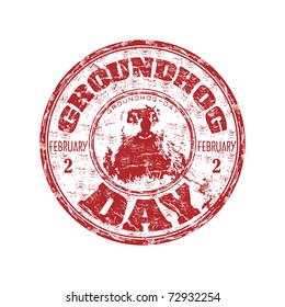 Red grunge rubber stamp with a little groundhog and the text Groundhog Day written inside the stamp