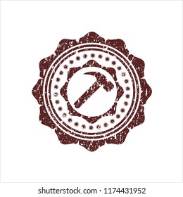 Red hammer icon inside distressed rubber grunge texture stamp
