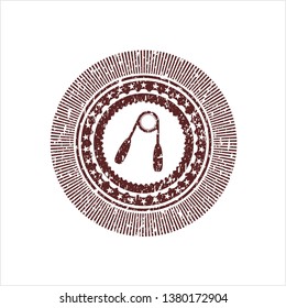 Red hand gripper icon inside distress rubber stamp with grunge texture