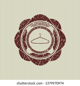 Red hanger icon inside distress grunge stamp