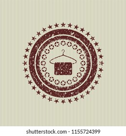 Red hanger with towel icon inside grunge style stamp