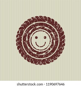 Red happy face icon inside grunge style stamp
