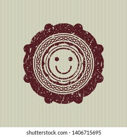 Red happy face icon inside distressed rubber grunge seal