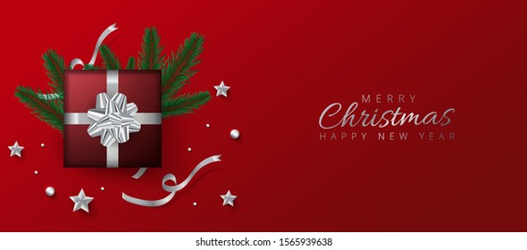  Red header or banner design decorated with gift box, baubles and pine leaves for Merry Christmas and Happy New Year.