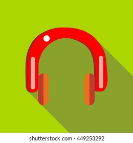 Red headphones icon in flat style on a green background