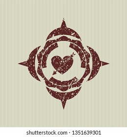 Red heart with arrow icon inside distress rubber stamp with grunge texture