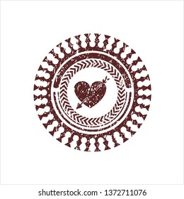 Red heart with arrow icon inside distressed rubber seal with grunge texture