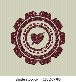 Red heart with arrow icon inside distress grunge seal