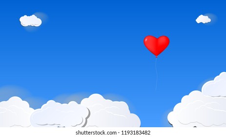 Red heart balloon float through the clouds.