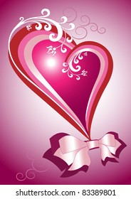 Red heart with a bow and decorated with branches of white flowers.