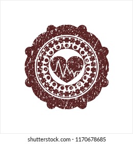 Red heart with electrocardiogram icon inside rubber seal with grunge texture