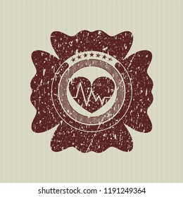 Red heart with electrocardiogram icon inside distressed rubber texture