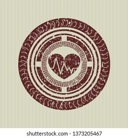 Red heart with electrocardiogram icon inside grunge style stamp