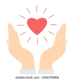 Red heart floating between two hands. Charity, care, orphans help
