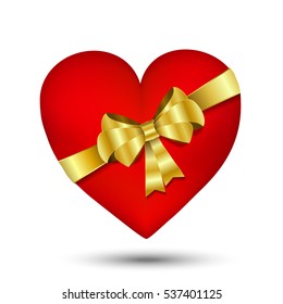 Red heart with gold bow and ribbons isolated on white background