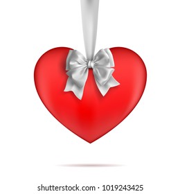 Red heart hanging on a white ribbon with a bow. Decorative design elements. Vetcor on a white background.