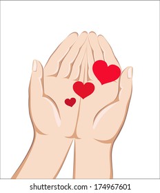 Red heart lying in the hands of