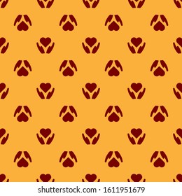Red Heart on hand icon isolated seamless pattern on brown background. Hand giving love symbol. Valentines day symbol.  Vector Illustration