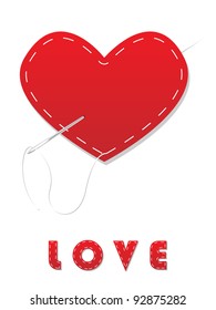 Red heart sewn with white thread