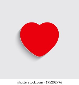 red heart with shadow on a grey background