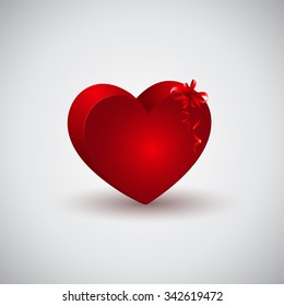 Red heart shape gift box with ribbon