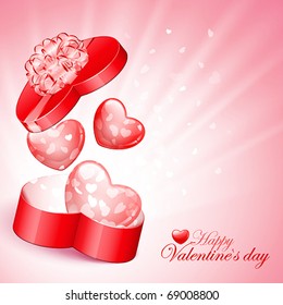 Red heart shape gift with light from inside