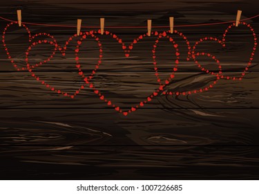 Red hearts  hanging on a rope with slothespins. Valentine's Day. Vector illustration. Greeting card with empty space for your label or advertising. On a wooden background.