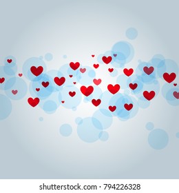 Red hearts on a blue background with bokeh. Element design for the Valentine's Day.