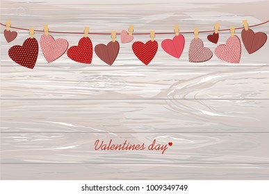 Red hearts  with a picture hanging on a rope. Valentine's Day. Vector illustration. Greeting card with empty space for your label or advertising. On a wooden background.