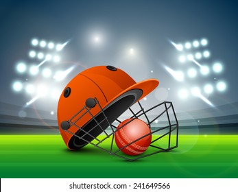 Red helmet with ball shining in night stadium lights for Cricket sports concept.