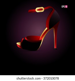 Red high heel on the dark background