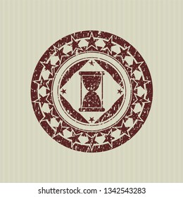 Red hourglass icon inside distressed rubber grunge texture seal
