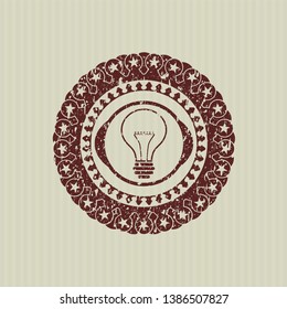 Red idea icon inside distressed rubber grunge texture seal