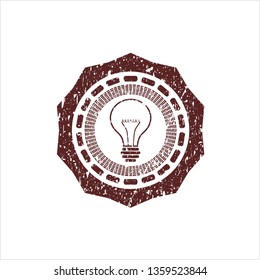 Red idea icon inside grunge stamp