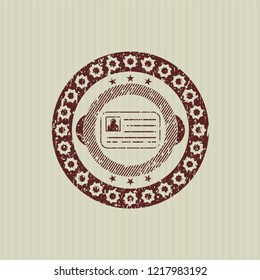 Red identification card icon inside rubber stamp