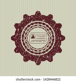 Red identification card icon inside distress rubber stamp with grunge texture