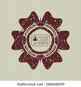Icono de tarjeta de identificación roja dentro del sello de goma con textura gruesa