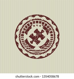 Red jigsaw puzzle piece icon inside distressed grunge seal