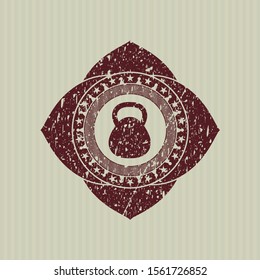 Red kettlebell icon inside distress rubber grunge seal