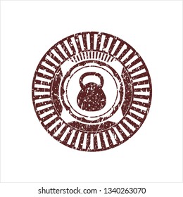 Red kettlebell icon inside distressed grunge stamp