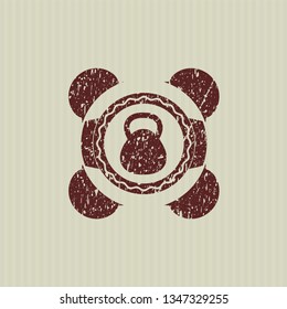 Red kettlebell icon inside distressed rubber seal with grunge texture