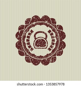 Red kettlebell icon inside distressed rubber grunge seal