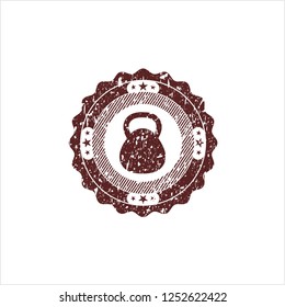 Red kettlebell icon inside rubber stamp
