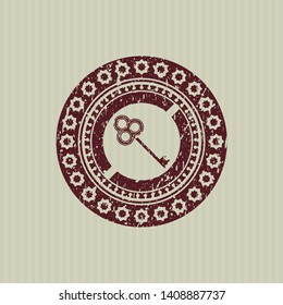 Red key icon inside distress rubber seal with grunge texture