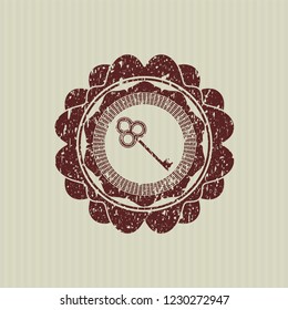 Red key icon inside distressed rubber grunge stamp